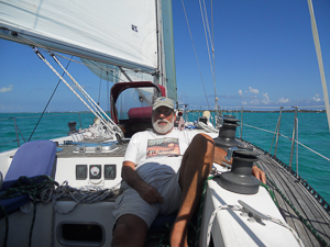 My Friend Bruce working hard.on passage from Miami to the Abacos